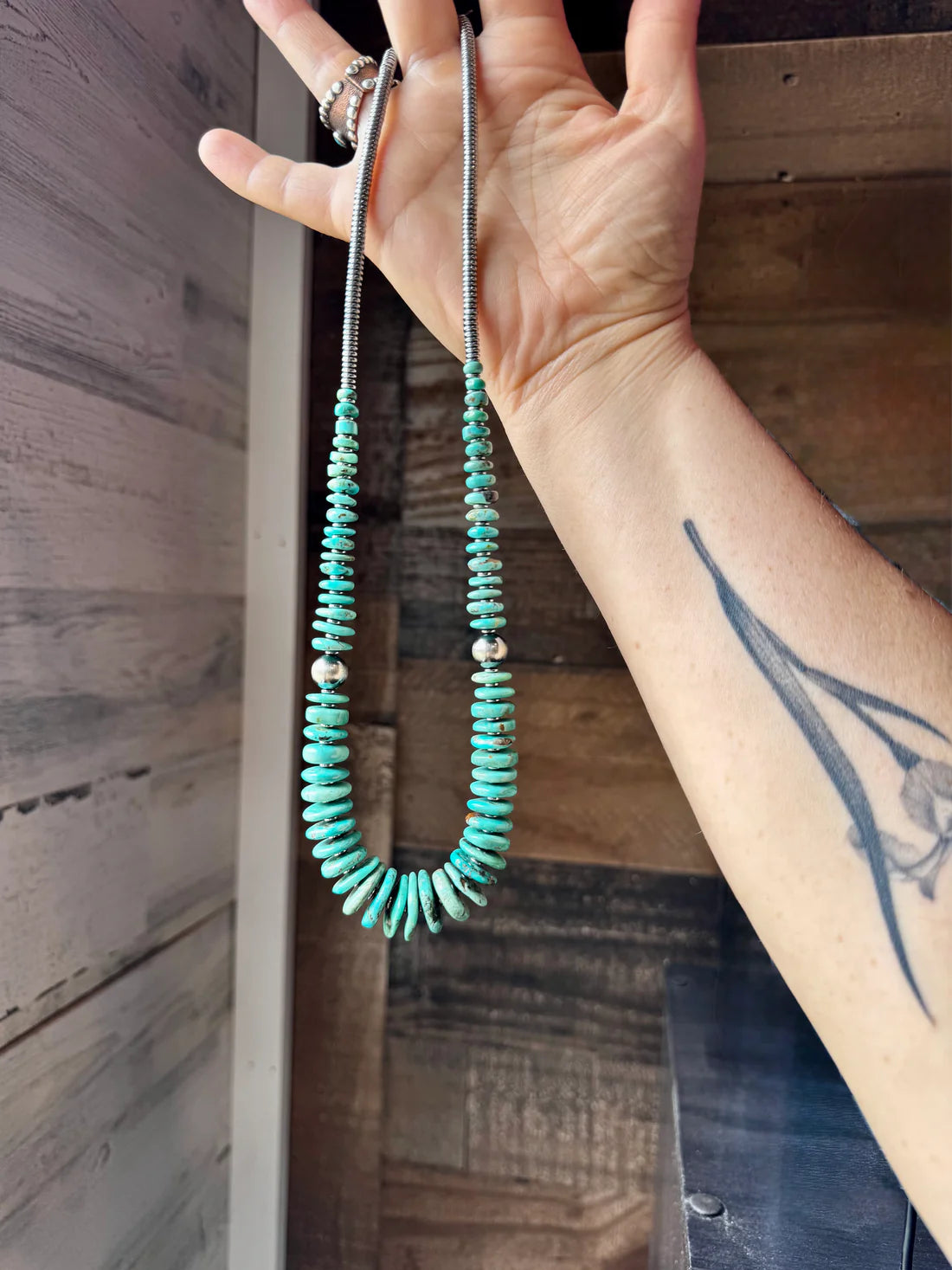 22 inch green/blue graduated necklace with sterling silver pearls
